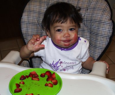 Mia eating strawberries for breakfast
