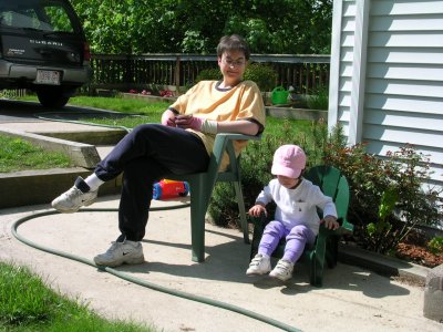 Mia outside in her little chair with Mommy